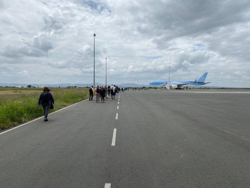 walkingtowardplanekilimanjaroairporttanzania.jpg